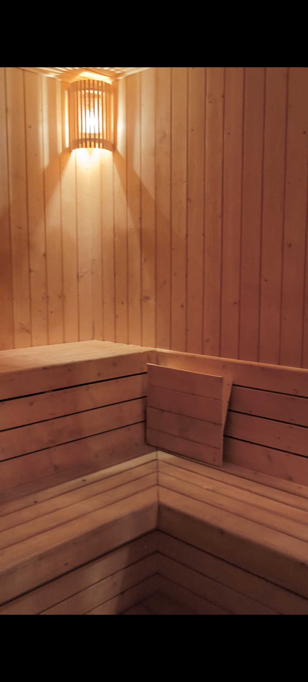 Sauna bath with wooden benches at Swim Gym, Dewas